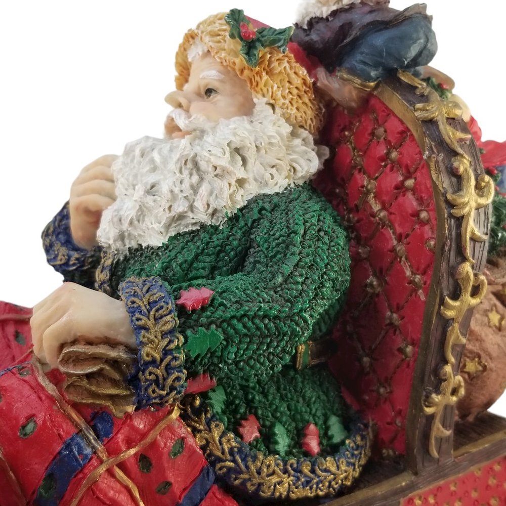 Santa in a Red Sleight Bed Resin Holiday Décor with Elves, Presents, And Toys - Picture 10 of 15